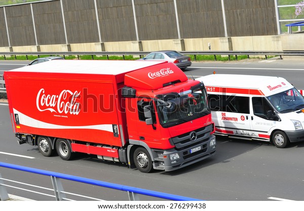 FRANKFURT,GERMANY-APRIL 16:red Coca- Cola truck on\
April 16,2015 in Frankfurt,Germany.Coca-Cola is a carbonated soft\
drink sold in stores, restaurants, and vending machines throughout\
the\
world