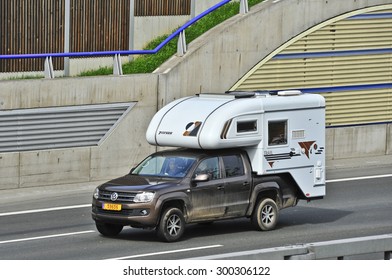 FRANKFURT,GERMANY-APRIL 16:Volkswagen caravan on the highway on April 16,2015 in Frankfurt,Germany. - Shutterstock ID 300306122
