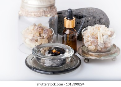 Frankincense burning on a hot coal. Frankincense is an aromatic resin, used for religious rites, incense and perfumes.