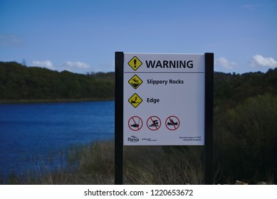 Frankston, VIC / Australia - Nov 3 2018: Slippery Rocks , No Fishing, No Swimming, No Boat Warning