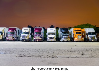 Franksville, WI, United States; August 6, 2017: Tractor-trailer trucks parked for night at a local Pilot Truck Stop in Franksville, Wisconsin, a suburb of Milwaukee, WI. 