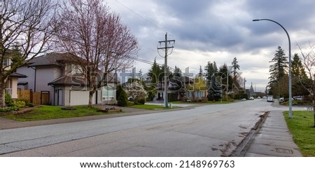 Fraser Heights, Surrey, Greater Vancouver, BC, Canada. Street view in the Residential Neighborhood during a colorful spring season. Colorful Sunrise Sky.