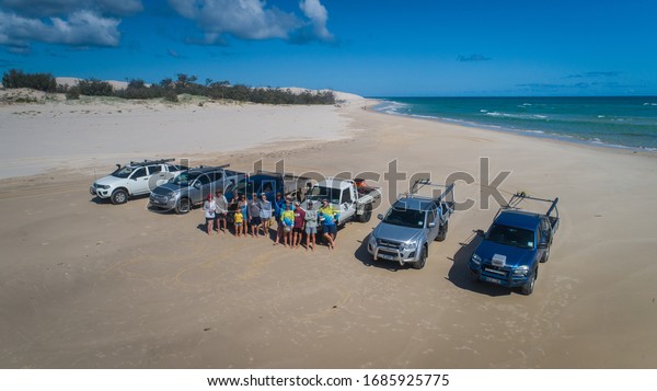 Fraser Island,\
Queensland / Australia: March 2020: Holidaymakers enjoy time\
fishing and four wheel driving on the beaches of Fraser Island, the\
world\'s largest sand\
island.