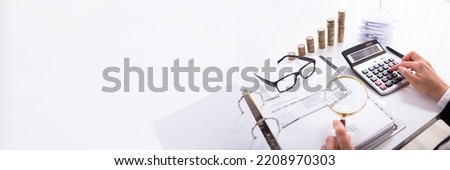 Fraud Auditor Using Magnifier Glass. Business Tax