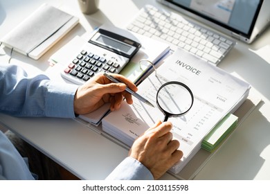 Fraud Investigation And Tax Audit. Investigator Or Auditor Using Magnifying Glass