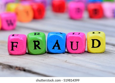 Fraud Word On Grey Wooden Table