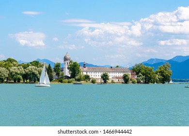 Fraueninsel, Frauenchiemsee on lake Chiemsee with boat, Sailboat, church, monastery. Bavaria, Bayern, Germany