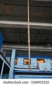 Frayed Climbing Rope In A Gymnasium