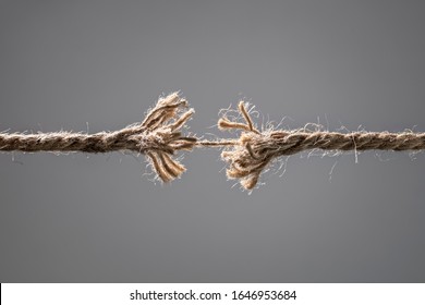 Frayed rope about to break concept for stress, problem, fragility or precarious business situation - Shutterstock ID 1646953684