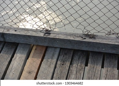 Frayed Wire On A Wooden Bridge
Thailand