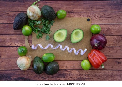 Frazzled face with halved avocado, fresh cilantro, and guacamole ingredients. Top view of food with a frazzled, confused, overwhelmed face. Healthy dieting with natural foods on a wooden background.