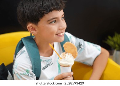 freckled boy smiling with an ice cream in his hand - Powered by Shutterstock