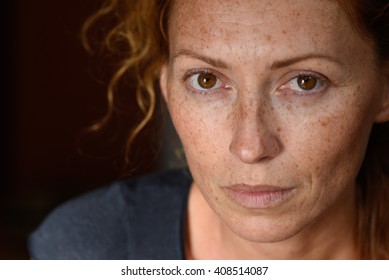 Freckled Young Woman Without Make Up Close Up