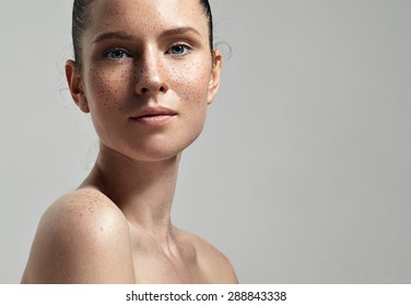 Freckles Woman's Face Portrait With Healthy Skin 