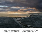 Fred Howard Park Tarpon Springs Florida long exposure sunset. Beautiful long exposure Fred Howard Park Tarpon Springs Tampa Florida sunset photo boulder s rocks in landscape foreground