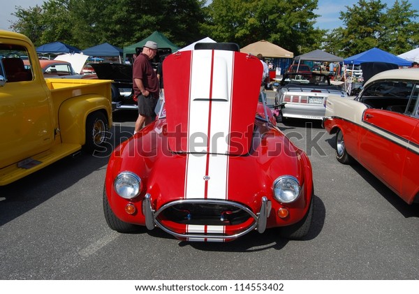 FREDERICK, MD-\
SEPTEMBER 16:1965 Red White Ford AC Cobra car on Sept. 16, 2012 in\
Frederick , MD USA. Alzheimer\'s Association Benefit Car Show at\
Motor Vehicle Administration in\
Maryland.