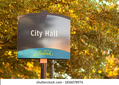 Frederick, MD, USA 10/13/2020: Frederick Is A Picturesque Historic Town In Maryland And The County Seat Of Frederick County. Signpost Shows City Hall Where Local Government Officials Work.  