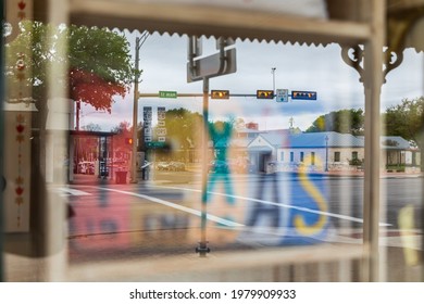 Fredericksburg, Texas, USA. April 13, 2021. Reflections In A Storefront Window In The Texas Hill Country.