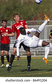 FREDERICTON, CANADA - OCTOBER 8: Michael Mutunda of St-Hubert, Que., does a bicycle kick versus Abbotsford, B.C. at the Canada Soccer U18 championships on Oct. 8, 2011 in Fredericton, Canada.