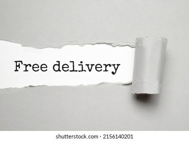 FREE DELIVERY Handwritten On Torn Notebook Page Crumpled Paper On Wood Texture Background.