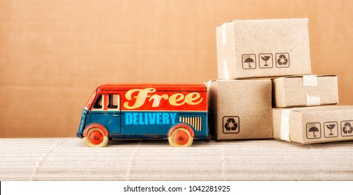 Free Delivery Van, Vintage Toy Truck With Cardboard Boxes. Shipping Concept.