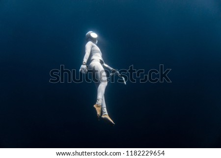 Free diving without fins in the deep blue sea