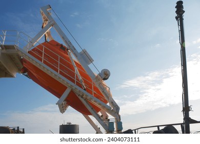 Free fall life boat secured on the boat deck of a ship at sea