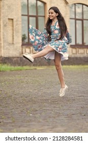 I am free. Happy girl jump up outdoors. Energetic child in suumer dress. Free to move. Summer vacation. Leisure and free time. Playing games. Freedom and happiness. Born free