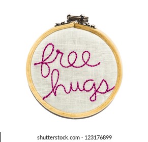 Free Hugs Sewn Onto A Needlepoint Round