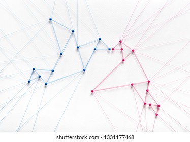 Free Love Concept On White Background. Network Of Pins And Threads In The Shape Of Two Birds Breaking Free And Kissing Symbolising Love And Freedom Of Choice.