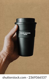 Free PSD premium quality coffee cup holding mockup ready to use