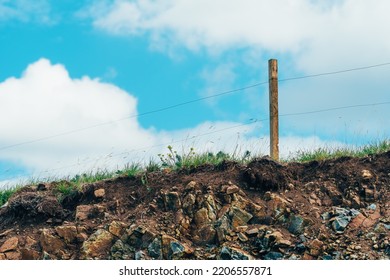 Free Range Farm Electric Wire Fencing On Zlatibor Hills With White Clouds In Background, Selective Focus