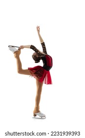 Free skating. Portrait of little flexible girl, figure skater wearing stage attire posing isolated on white studio backgound. Concept of movement, sport, beauty. Copy space for ad, text