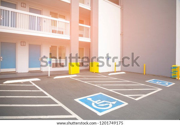 Free space\
Handicapped parking spot in motel or apartment, transportation\
infrastructure road\
markings.