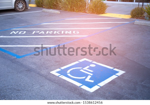 Free space\
Handicapped parking spot in motel or apartment, transportation\
infrastructure road\
markings.