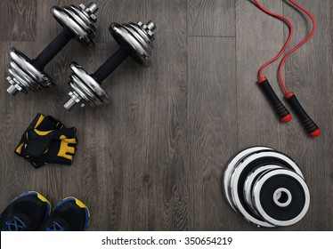 free space on the wooden floor surrounded fitness equipment - Shutterstock ID 350654219
