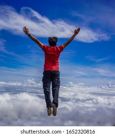 Free Spirit Man Jumping In The Clouds 