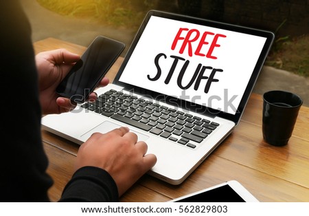 FREE STUFF man hand notebook and other office equipment