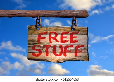 Free stuff motivational phrase sign on old wood with blurred background
