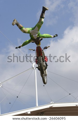 Free style motocross rider performs a no hander stunt during a show, please check out my portfolio to see my other extreme sport still images and video clips.