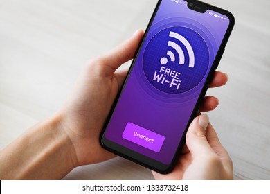 Free Wifi Connection On Mobile Phone Screen. Internet And Telecommunication Technology Concept.