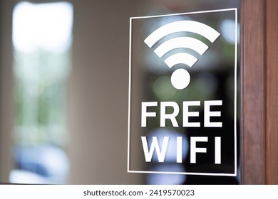 Free wifi icon symbol, wifi signal with wave signal icon on glass background in cafe shop. - Powered by Shutterstock