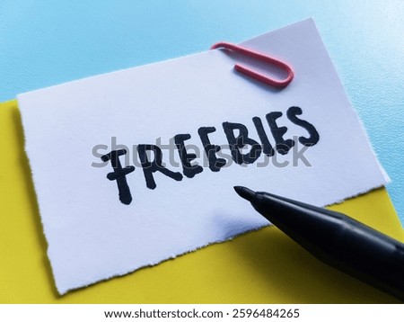 Freebies writting on table background.