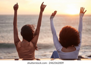 Freedom, beach sunset and couple of friends on road trip by car with back and arms in air. Transport, vacation and holiday fun together by the sea and ocean on spring break on adventure in Florida - Powered by Shutterstock