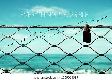 freedom concept. image fence and old rusty lock and birds flying in the horizon. everything is possible slogan