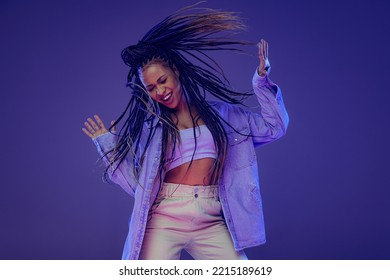 Freedom. Emotional african girl in jeans and shirt dancing, having fun isolated on dark blue background. Concept of beauty, art, fashion, youth, sales and ads. Pretty woman posing, dancing. - Powered by Shutterstock