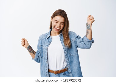 Freedom And Happiness. Carefree Woman Having Fun Dancing, Close Eyes And Smile While Relaxing With Music, Standing Upbeat Against White Background