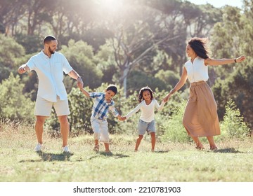 Freedom, Happy Family And Fun In A Park With Black Children And Parents Bonding And Playing On Grass. Love, Energy And Kids Excited And Happy While Enjoying A Fun Dancing Activity With Mom And Dad