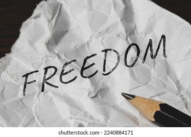 Freedom - an inscription in pencil on a piece of paper. - Shutterstock ID 2240884171