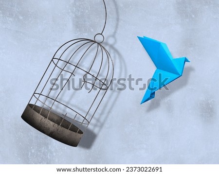 Freedom. Paper bird flying out of broken cage on light background